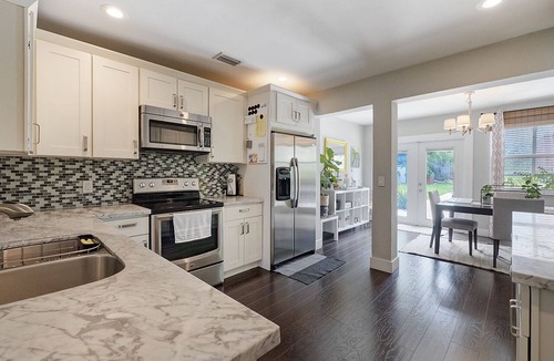 South Palm Park Neighborhood Association House | Lush Tropical Oasis! HEATED Pool, 1 mile to downtown, 2 miles to public beach