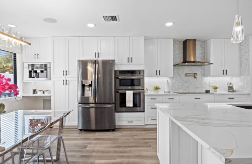 Tropic Palms House | Luxe Coastal Retreat - 4BR w/Pool, Hot Tub, Arcade & Work Space - 3 mi to beach