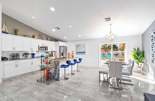 Delray Beach House | Luxe Heated Pool Home, Tiki Hut, Bar, Air Hockey!