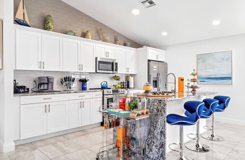 Delray Beach House | Luxe Heated Pool Home, Tiki Hut, Bar, Air Hockey!