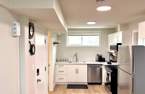 Saskatoon House | LUXLOFT SUITE. Cozy 2-bedroom basement suite in a serene location.