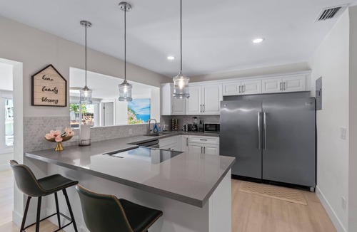 Garden Isles House | Luxurious Waterfront Ocean Access Heated Pool WD Wifi 75Ft Dock Bring Your Boat