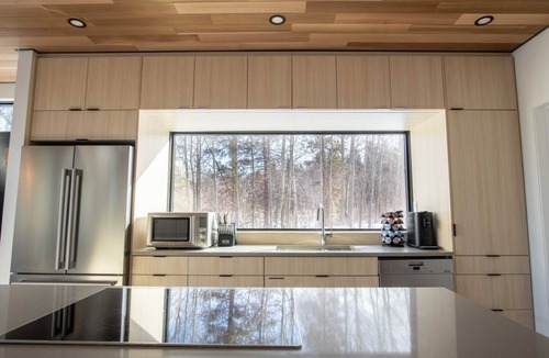 Black Hawk House | Luxury Lakefront Container Home - Sauna, Fishing, Kayaks & Mountain Views