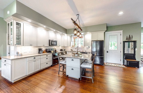 North Creek House | Nature-nestled lodge with wood stove - steps away from skiing, hiking, downtown