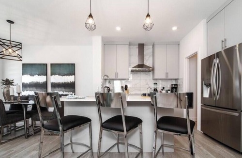Southwest Edmonton Apartment | New - Chic Modern Home - King bed - Foosball - Sleeps 8!