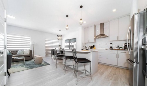 Southwest Edmonton Apartment | New - Chic Modern Home - King bed - Foosball - Sleeps 8!