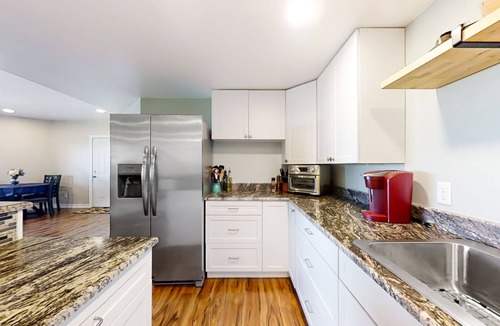 Fort Collins House | Newly built walkout basement with water views, patio, & Ping-Pong table