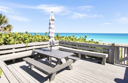 Juno Beach Condo | OceanFront Condo Renovates with Heated Pool & Hot tub Directly on the Beach!