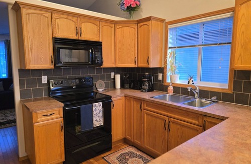 Red Deer House | Pet friendly 2 bedroom and full bathroom with soaker tub close to Westerner.