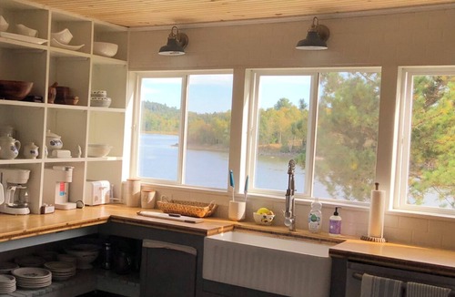 Calais House | Pet Friendly Waterfront home- Kayaks, Game Room, Playset, toddler area & office