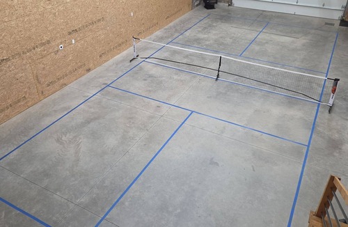 Centennial House | Pine & Peak Lodge in Centennial, WY Patio Seating & Game Area -No cleaning fee-