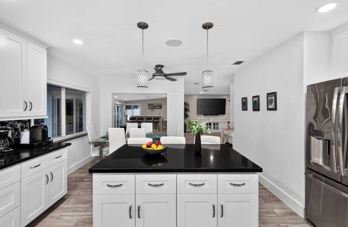 Bel Air House | Pompano Beach Retreat Private Pool + Canal-Front Tiki Lounge | Coral Current
