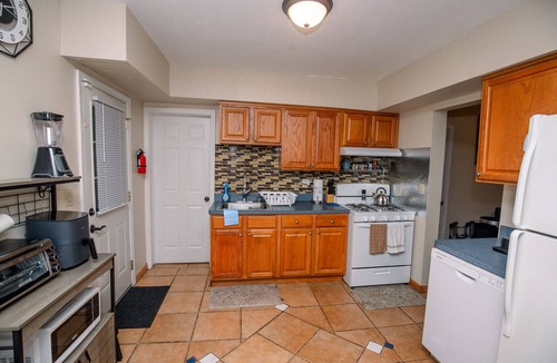 Garfield Heights House | Radiant Rockside Retreat, Fast internet, Self-check in, 3 bdrm, office, garage.