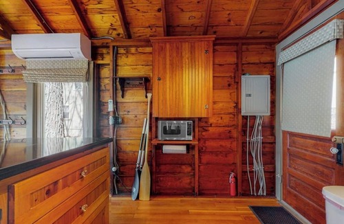 South Casco Apartment | Refurbished waterfront 1950s cabin with sauna, firepit, grill & kayaks - dogs ok