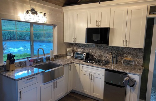 Dubois Cabin | Remodeled Cabin on 40 private acres of Wind River frontage with R/V hookup.