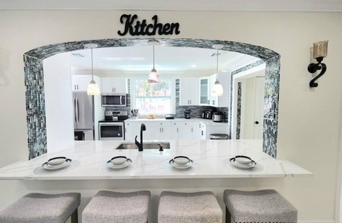 Royal Palm Beach House | Remodeled cozy family house with heated pool, 10 min from the airport!