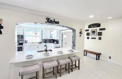 Royal Palm Beach House | Remodeled cozy family house with heated pool, 10 min from the airport!