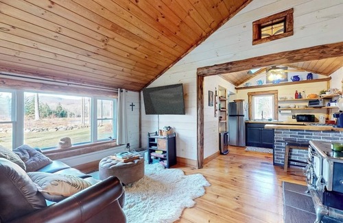North Troy Cabin | Renovated historic cabin with mountain views, lake access, & electric fireplace