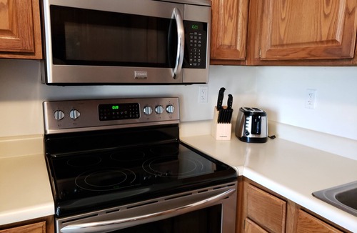 Winnisquam Condo | Right on the Water at Lake Winnisquam, w/Balcony, Boat Dock, & Sandy Beach