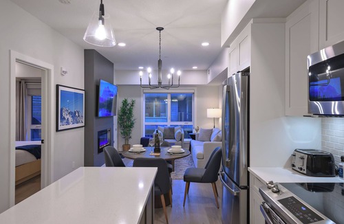 Dead Man's Flats Apartment | Rockies Retreat Getaway Heated Pool Hot Tub Gym