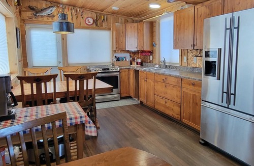 Laramie Cottage | Rustic Wyoming Lake Cottage with Mountains Views.