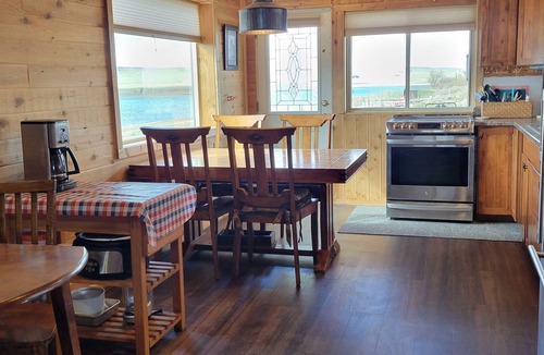 Laramie Cottage | Rustic Wyoming Lake Cottage with Mountains Views.