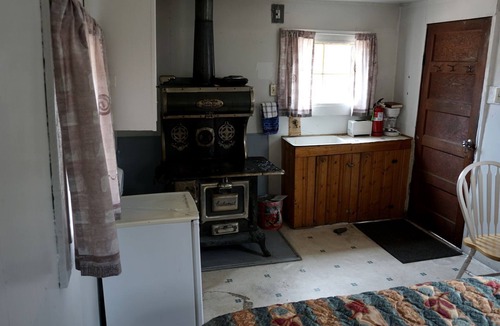 Bellvue Cabin | Simple Country Cabin with Ornate Wood Stove in the Colorado Mountains of Poudre Canyon