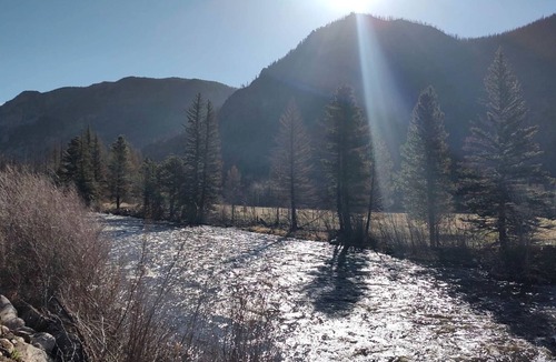 Bellvue Cabin | Simple Country Cabin with Ornate Wood Stove in the Colorado Mountains of Poudre Canyon