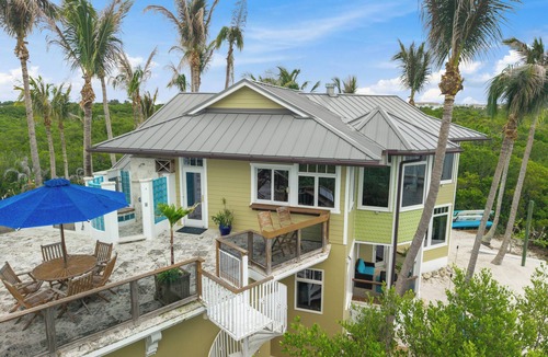 Wabasso Beach House | Stunning Riverfront Home with Private Beach and Close to the Ocean.