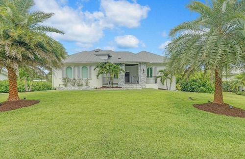 Palm City House | Stunning Water Front River House with Gourmet Kitchen, Pool & Large Boat Dock!