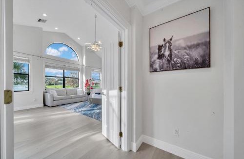 Wellington Villa | Stylish Lake Luxe Equine on waterfront w screened in heated pool Lake Views Hosted By Relaxtay