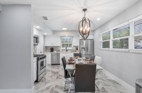 West Palm Beach Villa | The Coral Villa - Heated Pool Spa and Lush Garden