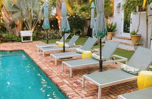 West Palm Beach Villa | The Grove Club: Palm Beach elegance, heated pool