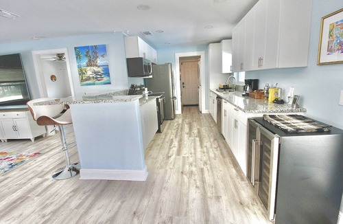 Stuart House | Triple Palm Oasis - Heated Pool with Hot Tub - Stuart