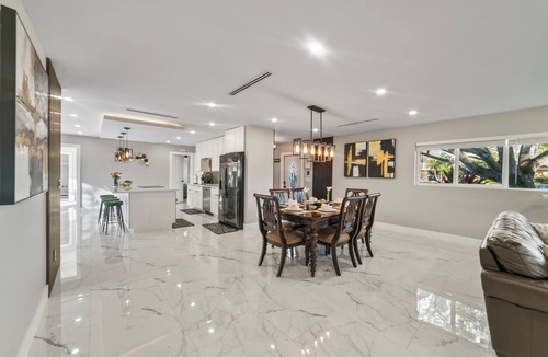 West Palm Beach Villa | Tropical Luxe Oasis with warm Pool,5 bedr 3 bath& Mini Golf, Impact Windows