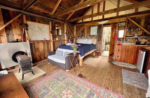 Bernard Cabin | Waterfront Cabin with Private Dock and Cobblestone Beach