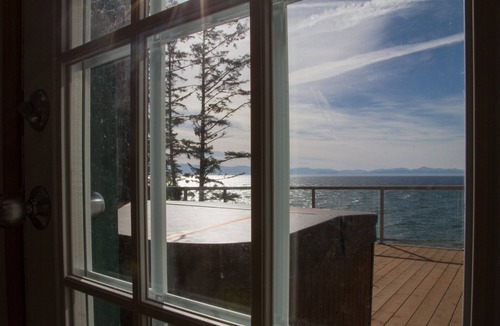 Juan de Fuca Electoral Area House | Waterfront home with jaw-dropping views, easy beach access, hot tub