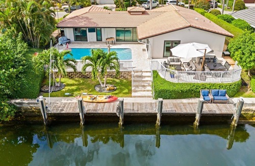 Lighthouse Point House | Waterfront~HUGE Heated Pool~Open Floor Plan~BIG Patio with Lots of Seating + Dock~Near Beaches