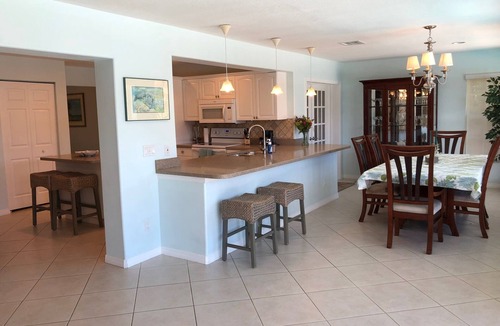Fort Pierce Shores House | Waterfront Island Home with Dock, Pool and just steps to the Beach!