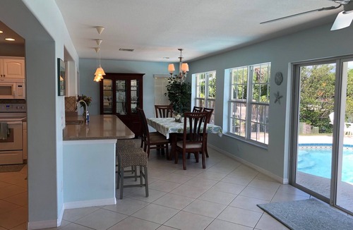 Fort Pierce Shores House | Waterfront Island Home with Dock, Pool and just steps to the Beach!