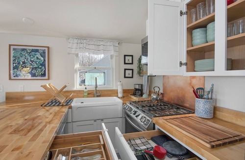 Malletts Bay Cottage | Welcome to 54 West Lake Shore Drive, a charming, single-floor home near the peaceful shores of Lake Champlain. This 1,200-square-foot residence offers 2 bedrooms (1 King, 1 Queen), 1.5 bathrooms with a shower and soaker tub. The thoughtfully designed