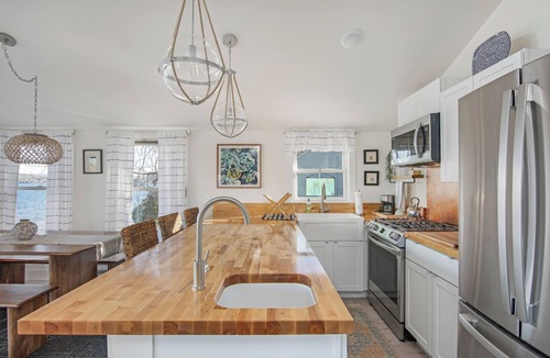 Malletts Bay Cottage | Welcome to 54 West Lake Shore Drive, a charming, single-floor home near the peaceful shores of Lake Champlain. This 1,200-square-foot residence offers 2 bedrooms (1 King, 1 Queen), 1.5 bathrooms with a shower and soaker tub. The thoughtfully designed