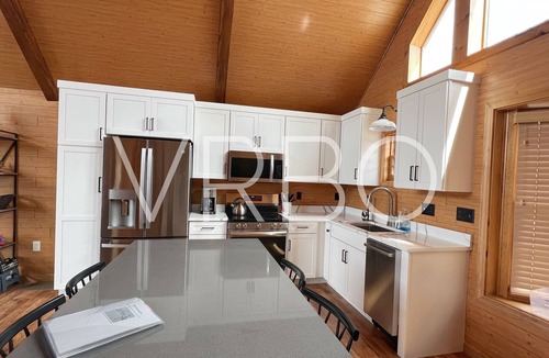 Gilford House | Winnipesaukee Beach house sits on 100’ of frontage and includes a dock slip