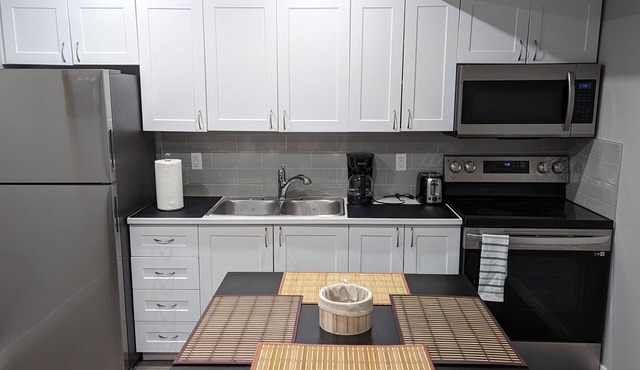 Cozy 2BR basement suite near the airport & highway—for every stay!