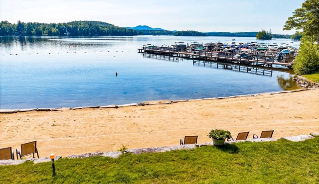 Idyllic lake retreat with beach access, firepit, wraparound porch, & great views