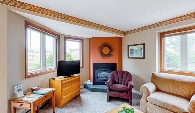 Inviting ski-in/out condo with mountain view, fireplace, deck & washer/dryer