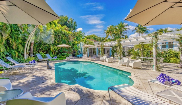 Key West Estate in West Palm Beach with 2 separate homes & stunning pool oasis.