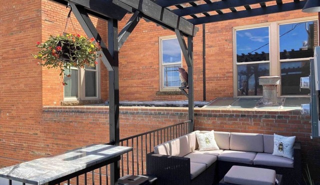 Luxurious industrial-chic loft in historic downtown Sheridan. This stunning 2-bedroom, 2-bath apartment sleeps up to 9, featuring 2 king suites, 2 1/2 bathrooms sleeping alcove, modern kitchen, fireplace, & Main Street balcony views.