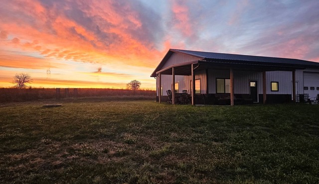 Modern home on acreage with pond, trails, rolling hills, and sunset views