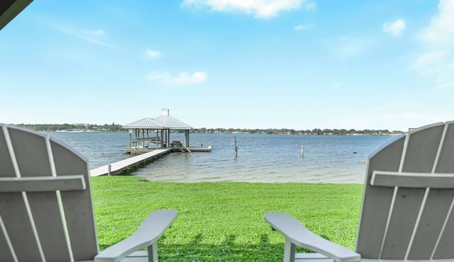 Modern Waterfront Lakehouse, with a private beach and a spacious boat dock.